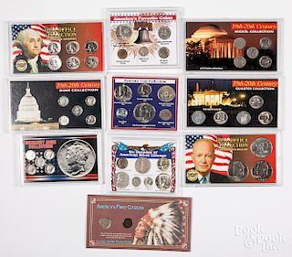 Large group of US coin sets.