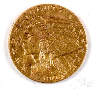 1909 Indian Head two and a half dollar gold coin.