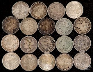 Nineteen Morgan silver dollars.