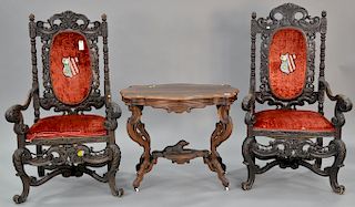 Three piece lot to include Victorian center table (ht. 29 in., top: 23" x 36") and two carved oak armchairs.Provenance: Estate of Stephen M. Serlin of