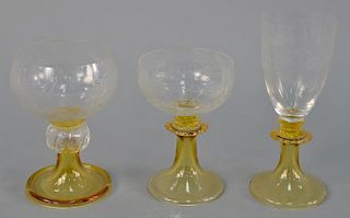 Set of etched glass stem glasses with amber stems, twelve white wine, six water, eight champagne, and three miscellaneous, 29 total ...