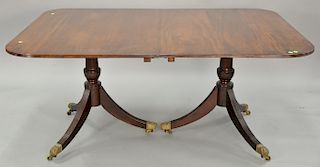 Custom mahogany two part dining table on pedestal bases with two 21 1/2 inch leaves. ht. 29 1/2 in., top closed: 47" x 66 1/2", top ...