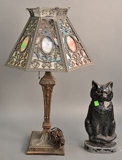 Two piece lot including panel shade table lamp ht. 24 in. (one cracked panel) and cast iron cat door stop with glass eyes ht. 12 1/4...