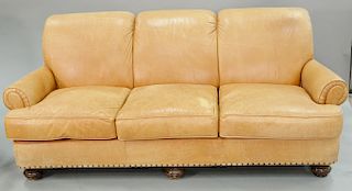 Leather upholstered sofa (lg. 82 in.) and easy chair.