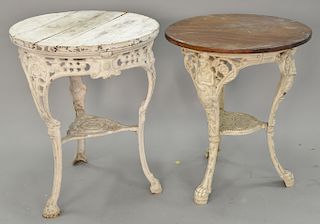 Two iron base round tables. ht. 29 in., dia. 24 in. Provenance: From an estate in Lloyd Harbor, Long Island, New York