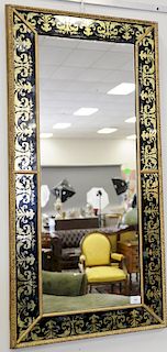 Pair of Venetian style mirrors having gold and black reverse painted glass and gilt wood frame. 67" x 22 1/2"