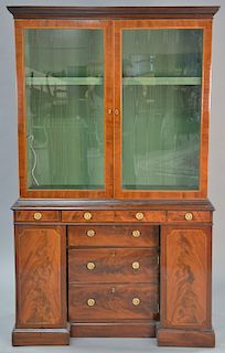George III mahogany two part cabinet with cloth lined top section, circa 1820. ht. 79 in., wd. 47 in.