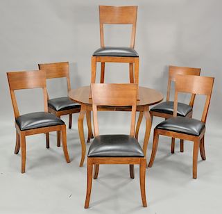 Asher Benjamin seven piece dinette set with table with three 21 inch leaves and six chairs. ht. 29 in., closed: dia. 42 in., open: 4...