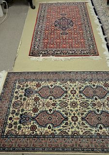 Two Oriental throw rugs. 3' x 5'2" and 3' x 5'4" Provenance: Estate of Stephen M. Serlin of Lake George, New York
