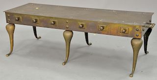 Brass footman type stand with six legs, ht. 15 in., top: 16" x 48" Provenance: From an estate in Lloyd Harbor, Long Island, New York