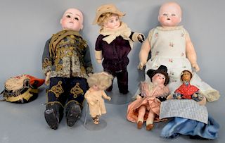 Six dolls including Unis France 301 bebe doll 6 1/2 in., miniature bisque head doll, wax head doll, German bisque head doll of a bab...