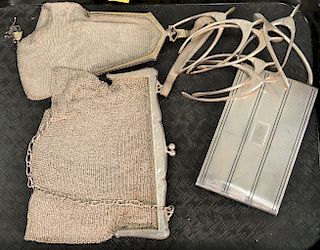 Ten piece silver lot to include two purses, one cigar case, and seven wishbone sugar tongs. 17.5 t oz.
