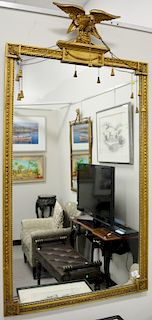 Large gilt wood rectangular mirror with flying eagle finial, 60" x 31" Provenance: From an estate in Lloyd Harbor, Long Island, New...