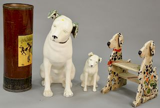 Four piece group to include two Nipper plastic RCA dogs, dog footstool, and a golfing can. ht. 18 in. to 36 in. Provenance: From an ...
