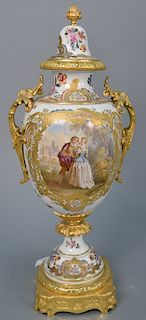 Meissen porcelain gilt ormolu mounted covered urn having painted landscape and romantic scenes on bronze base with cross sword mark....
