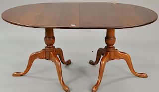 Eldred Wheeler cherry oval double pedestal table (no leaves). ht. 30 in., top: 42" x 64"