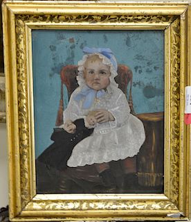 Early oil on tin depicting a boy holding a doll, 10" x 8".