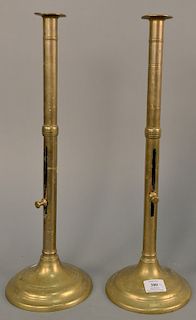 Pair of large brass push up candlesticks, ht. 20 in.