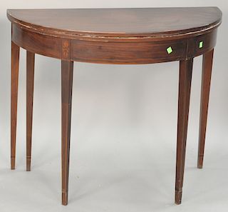 George III mahogany demilune game table, circa 1800. ht. 29 in., wd. 35 1/2 in.