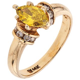 A diamond and simulant 14K yellow gold ring.
