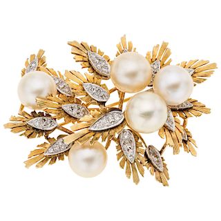 A cultured pearl and diamond 14K yellow and white gold brooch.