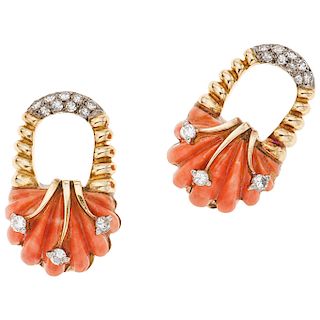 A coral and diamond 14K yellow gold and palladium silver pair of earrings.