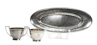 An American Arts and Crafts Hammered Silver Creamer and Sugar, Marshall Field & Co., Chicago, Length of tray 14 inches.