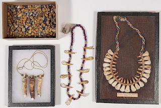 A GROUP OF NECKLACES AND BEADS