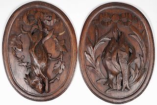 A PAIR OF CARVED OAK GAME PLAQUES, 19TH C