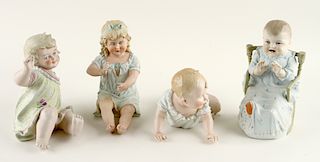 4 CONTINENTAL PORCELAIN PIANO BABY FIGURES
