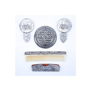 Collection of Five (5) Repousse Silver Plated Vanity Items. Includes: two combs and three mirrors. 