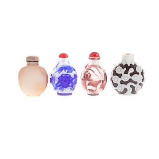 Four Chinese Carved Glass Snuff Bottles