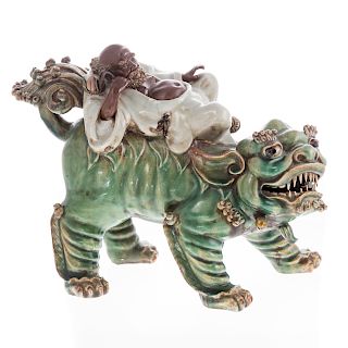 Chinese Porcelain Figure of Sage Riding Foo Dog