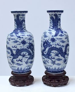 Pair Chinese 19th C. blue and white vases on carved rosewood stands