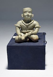 Asian celadon glazed pottery figure of seated man
