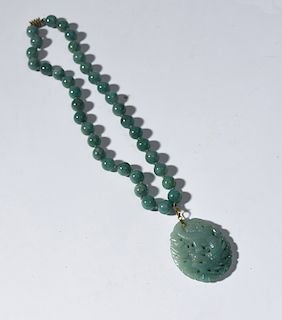 Large carved jade pendant on 14k finding