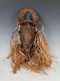 Carved Wood Mask with raffia and Cowrie Shells