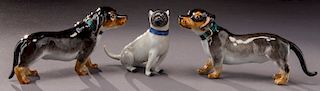 (3) Small Meissen porcelain dogs.
