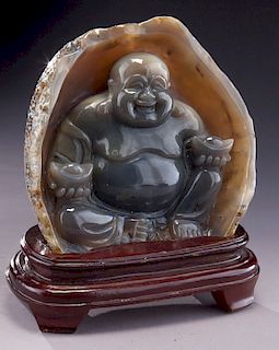 Chinese carved agate figure of a seated Buddha.