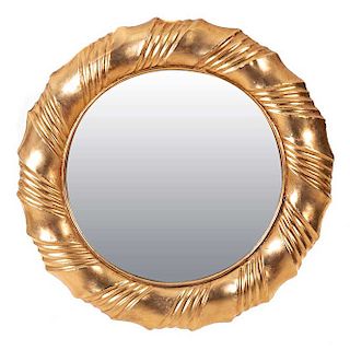Espejo. Siglo XX. Con marco en madera dorada y luna circular. Decorado con molduras.