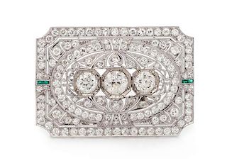 An Art Deco Platinum, Diamond, and Emerald Brooch, 9.30 dwts.