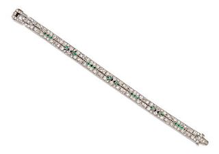 An Art Deco Platinum, Diamond, Emerald and Onyx Bracelet, 17.88 dwts.