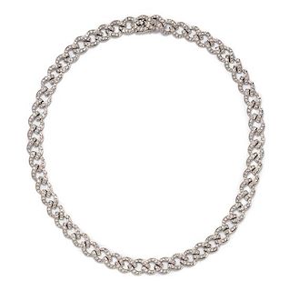 An 18 Karat White Gold and Diamond Curb Link Necklace, 25.60 dwts.