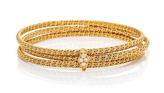 A Bicolor Gold and Diamond Bangle Bracelet, 28.00 dwts.