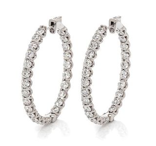 A Pair of 14 Karat White Gold and Diamond Hoop Earrings, 7.85 dwts.
