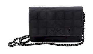 * A Chanel Black Canvas Travel Line Wallet on a Chain, 7 x 5 1/2 x 1 inches.