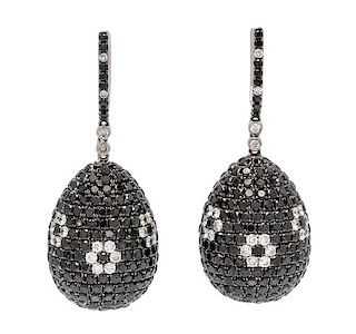A Pair of 18 Karat White Gold, Diamond and Black Diamond Drop Earrings, 20.30 dwts.