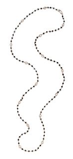 An 18 Karat Bicolor Gold, Black Diamond and Diamond Longchain Necklace, 8.25 dwts.