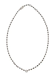 An 18 Karat Bicolor Gold, Black Diamond and Diamond Necklace, 3.00 dwts.