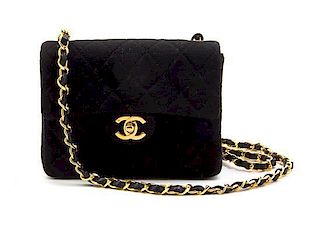 * A Chanel Black Quilted Wool Jersey Flap Bag, 7 x 5 1/2 x 2 1/2 inches.